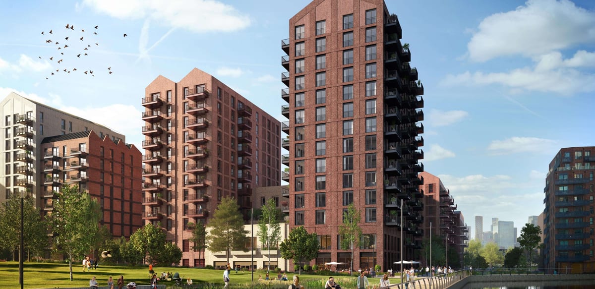 Computer-generated image of The Heron Collection's red-brick towers at Heron Wharf, seen across lawns and the River Lea on a sunny day