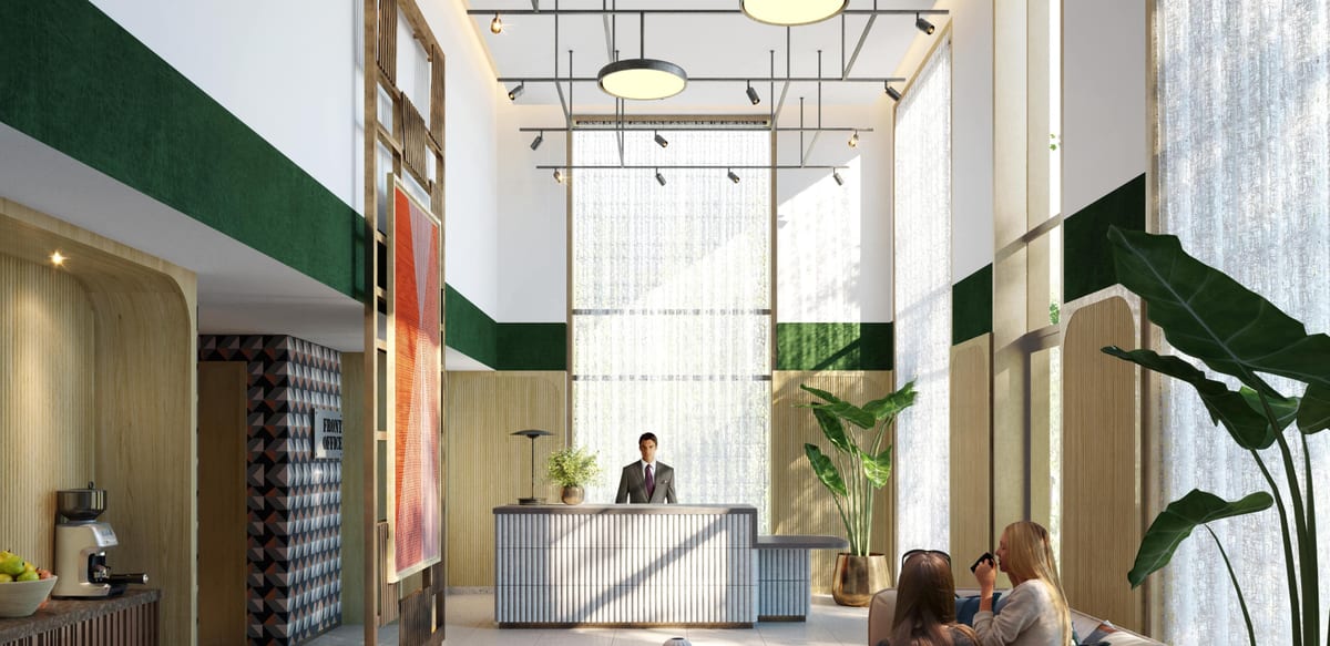 Computer-generated image of the double-height concierge lobby at The Millhouse, with a reception desk, green tiled panels and lounge seating